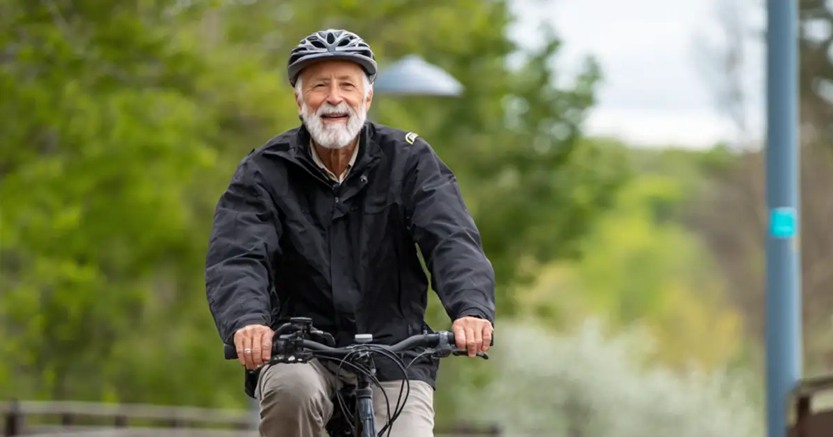 Photo of a senior on a bike